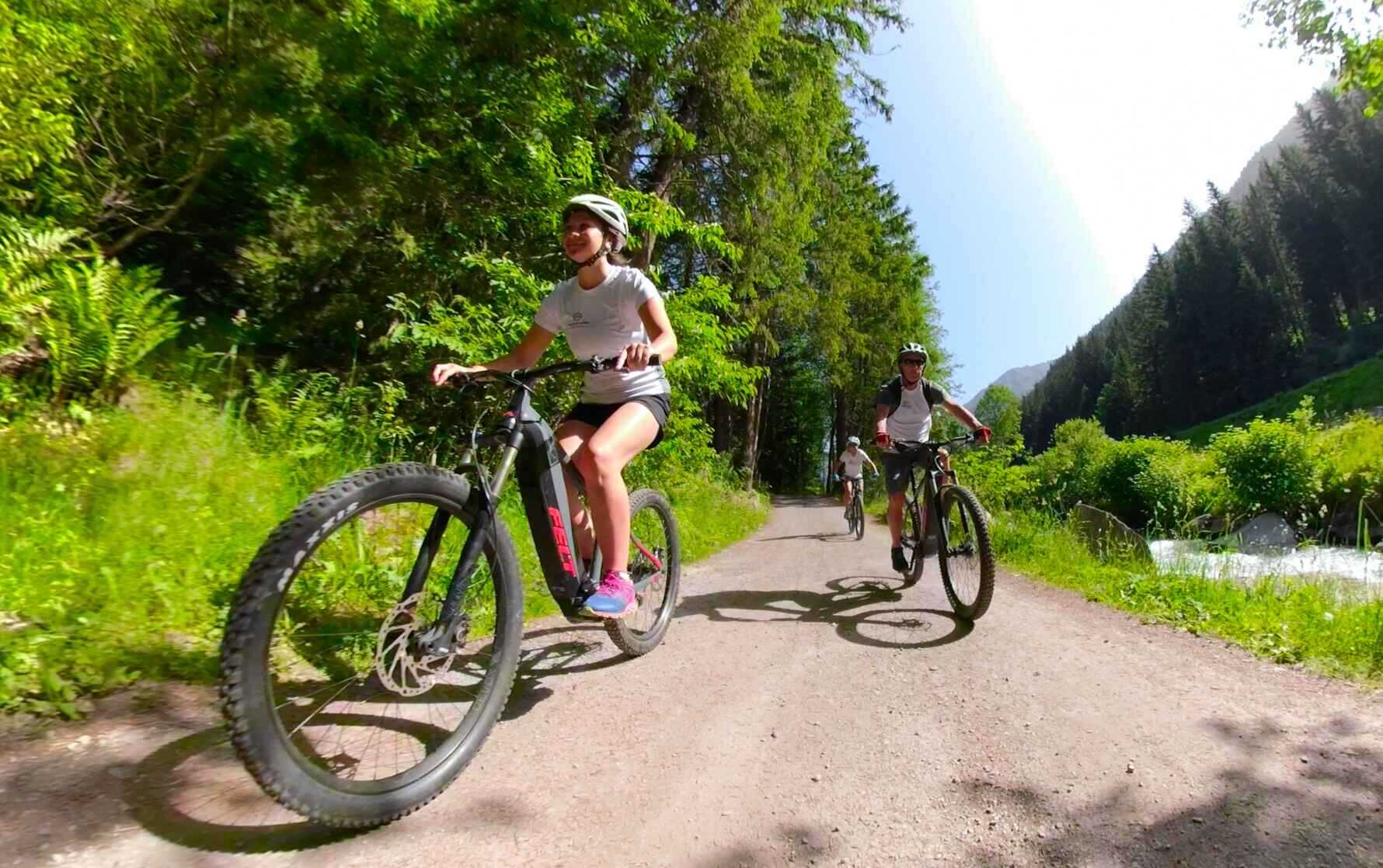 People riding e-bikes