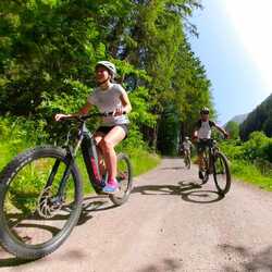 People riding e-bikes