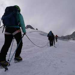 People hiking on a glacier