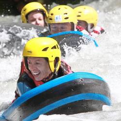 People hydro speeding on a river