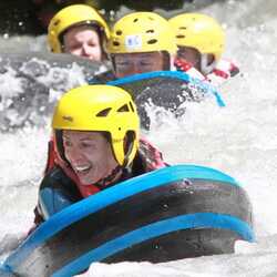 People hydro speeding on a river