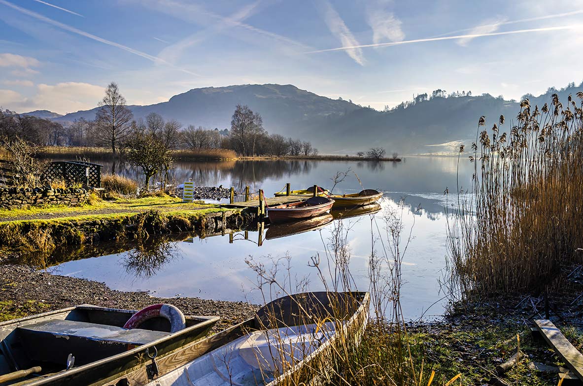 image showing a few row boats in a lake