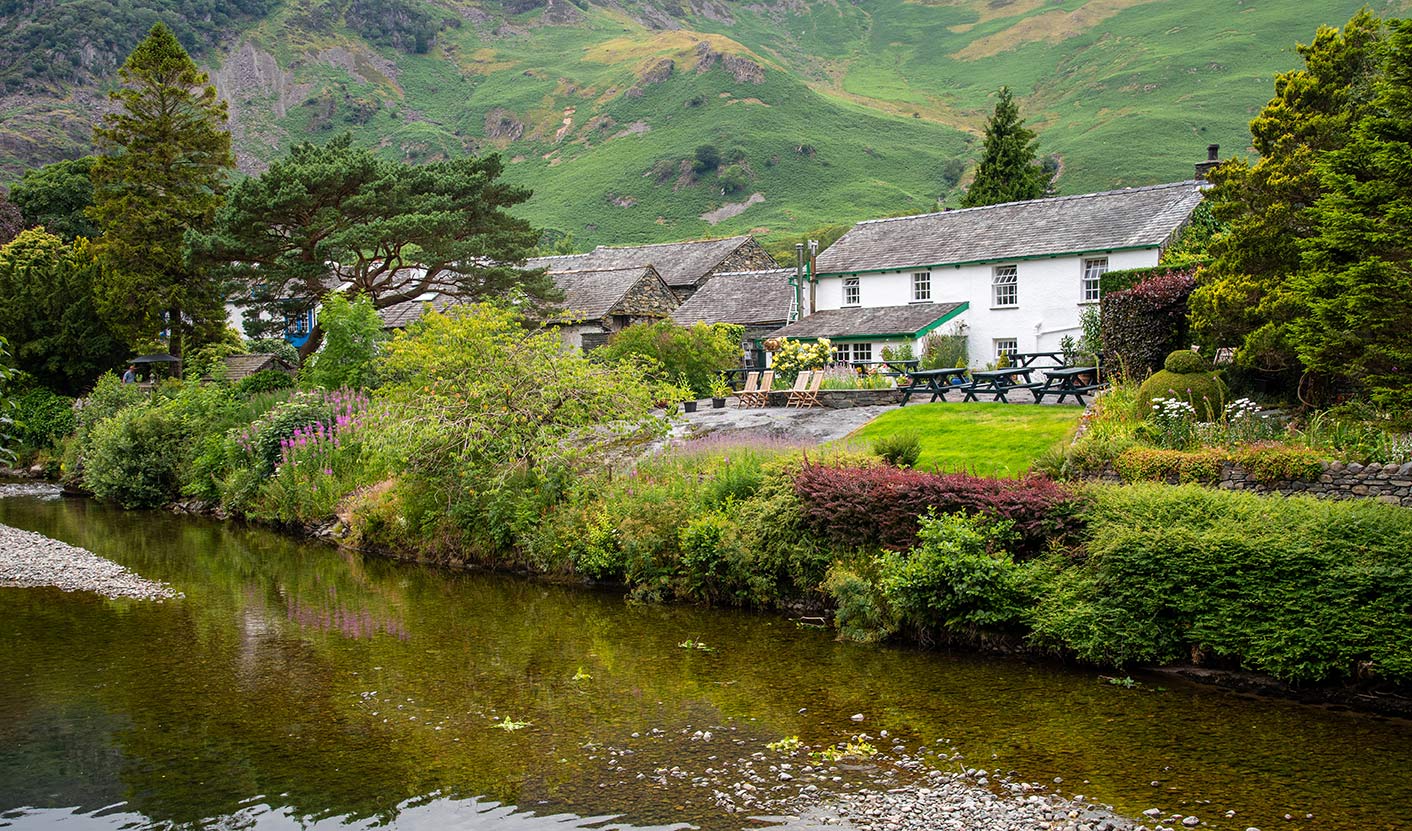 image showing a cottage by the lake