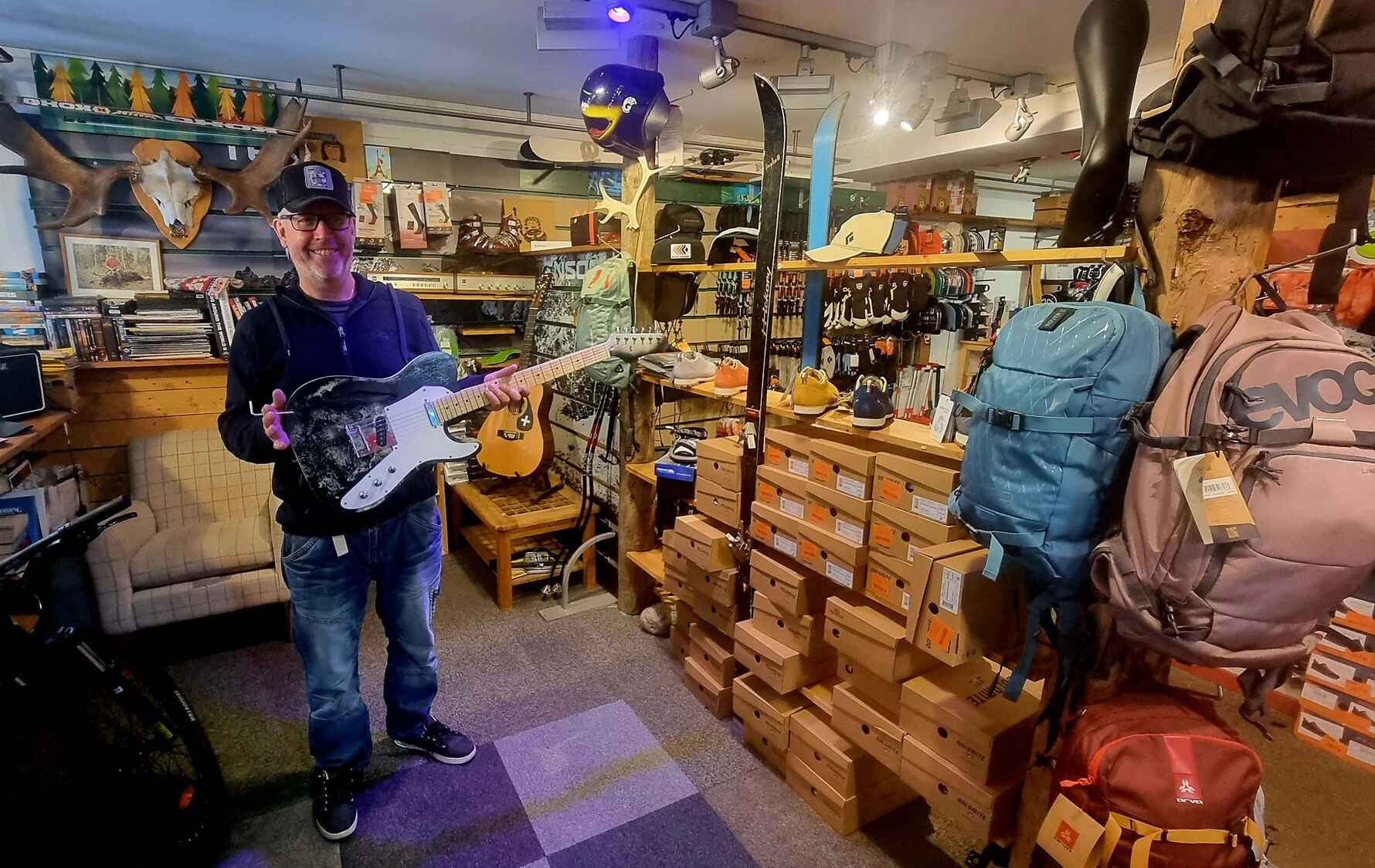 Rob holding a guitar that he built himself