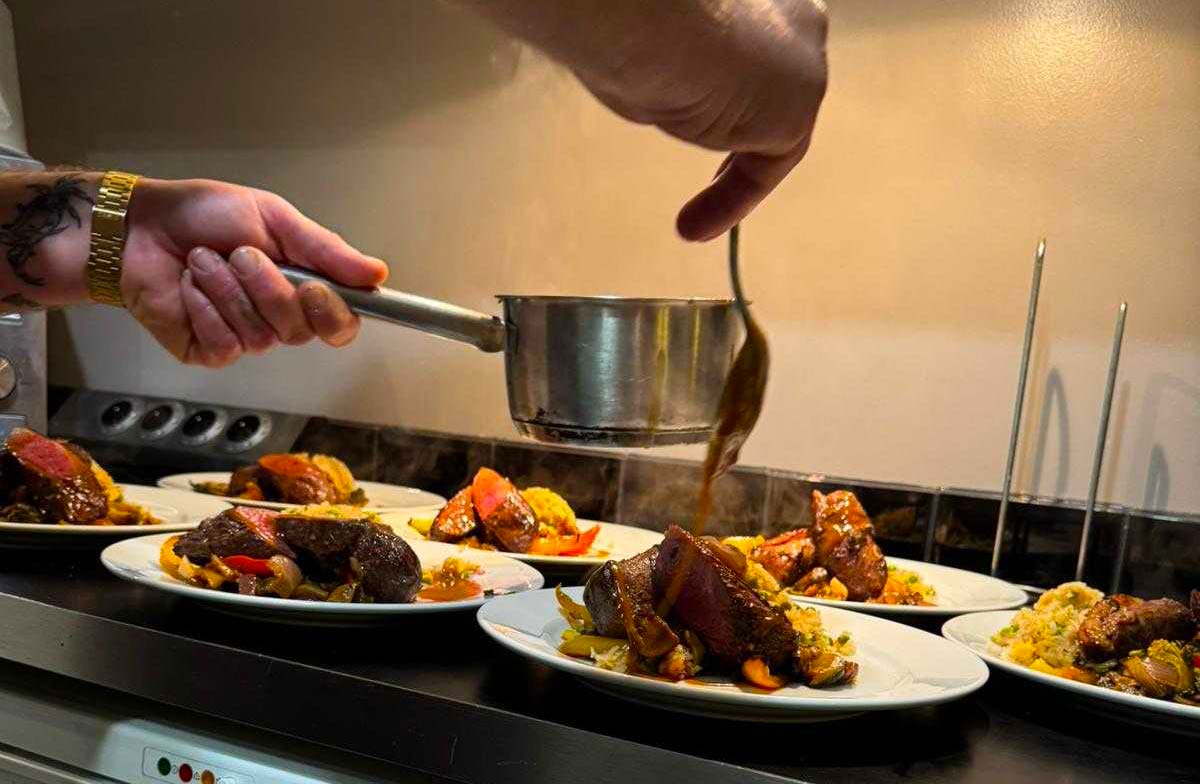 George plating up dinner 