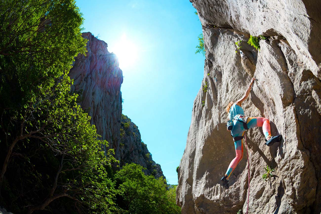 photo of a person rock climbing